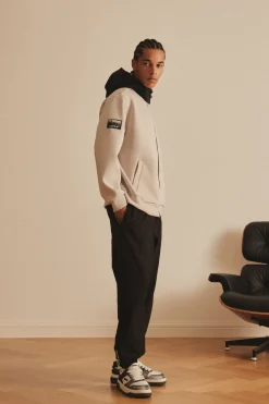 OUTDOOR WOVEN PATCH OVER FIT HOOD ZIP-UP